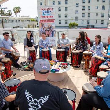 Religious School educators play drums at BAR Center, Venice